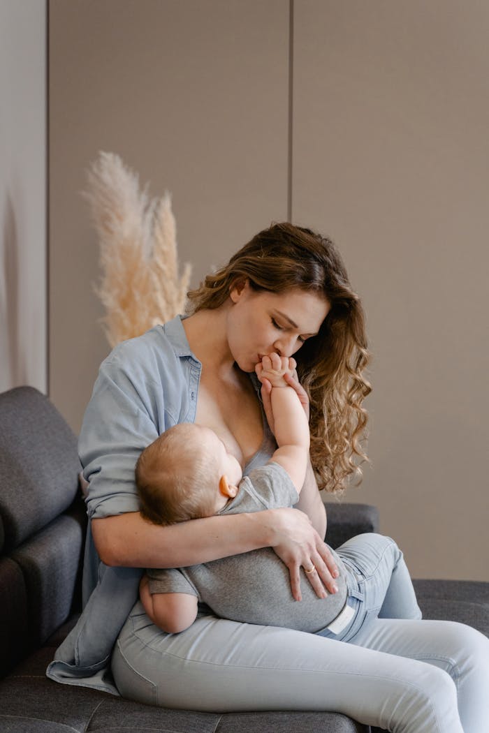A mother lovingly holding her baby, illustrating the warmth of family bonds.