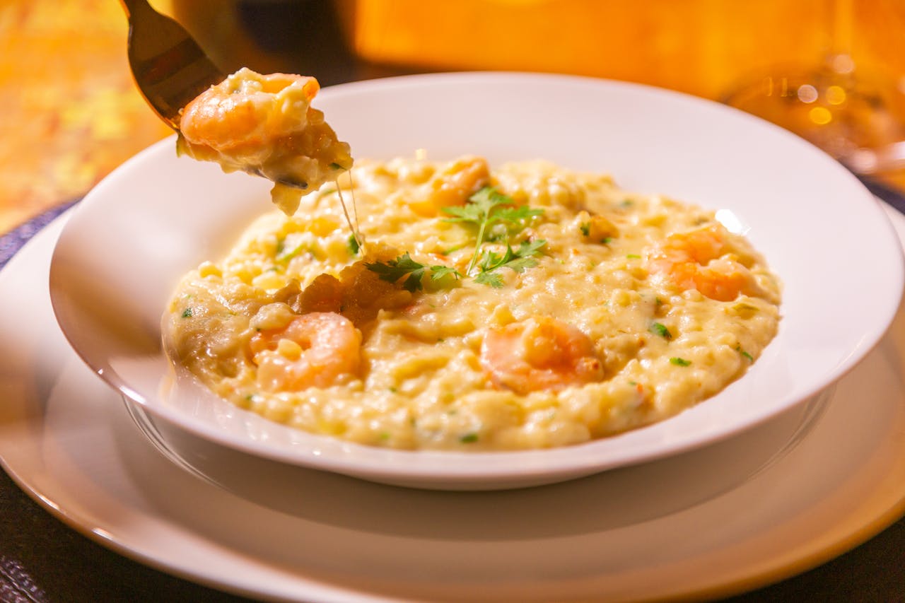 A delectable shrimp risotto garnished with herbs, perfect for a gourmet meal.